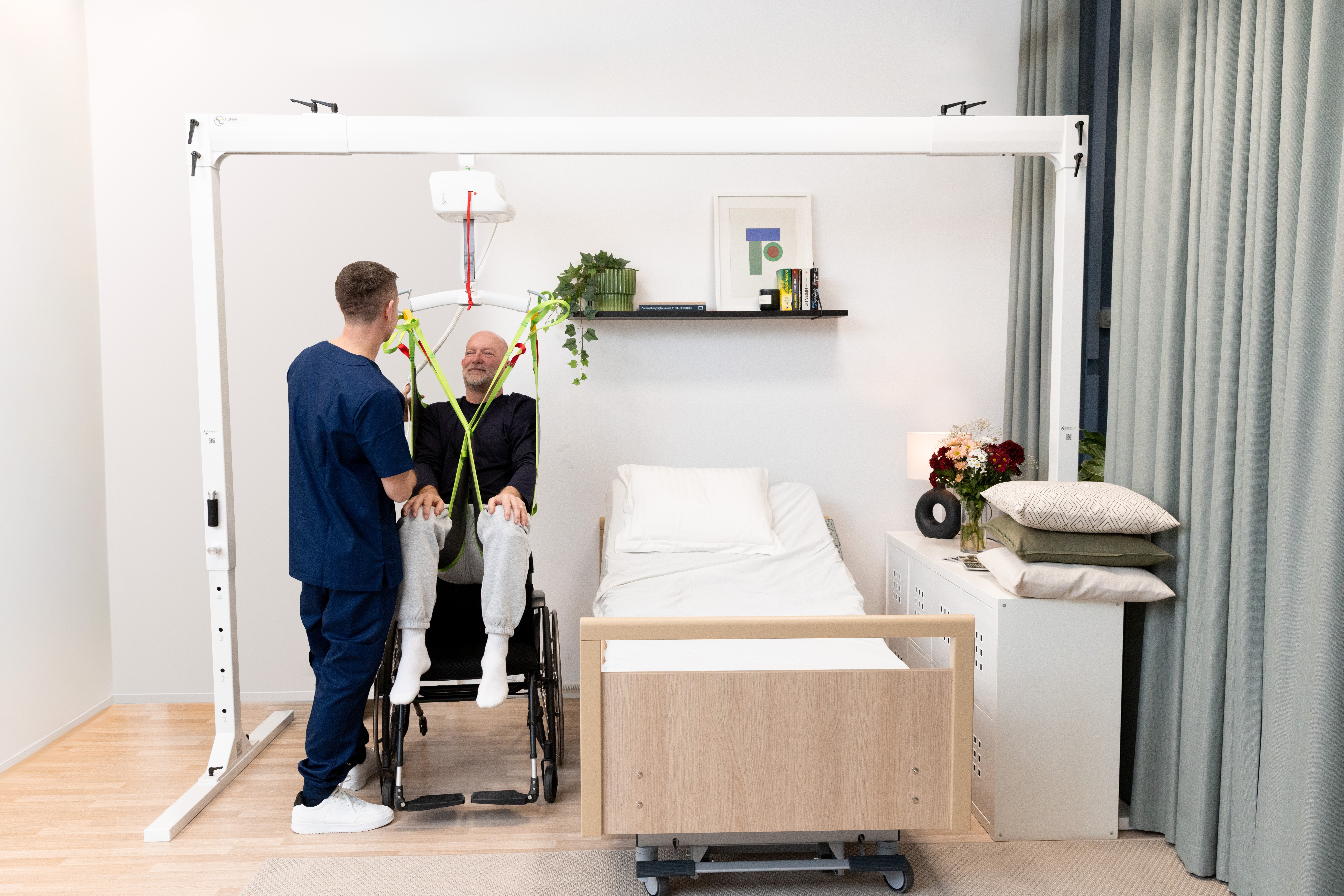 Human Care ceiling patient lift system in use at home