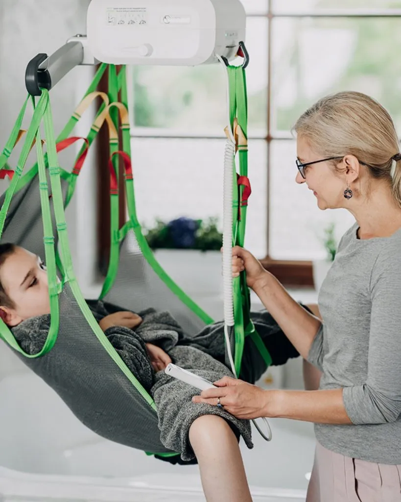 Human Care ceiling patient lift in a bathroom